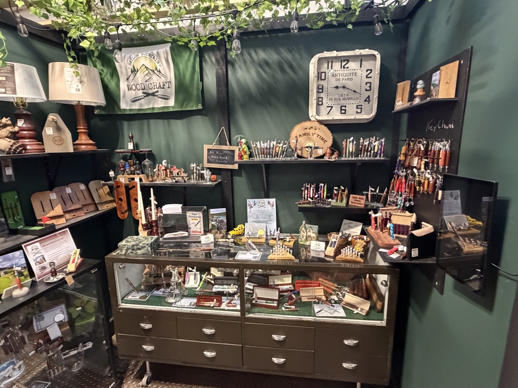 The Ratlum Mountain Woodcraft booth at Market Street Creatives with handmade pens on display